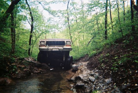 1978 Ford Bronco - This 1978 Ford Bronco is navigating a challenging off-road trail through a creek bed.