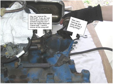 1979 Ford Bronco - A person is working on engine components, specifically the intake manifold and carburetor, with questions about smog equipment.