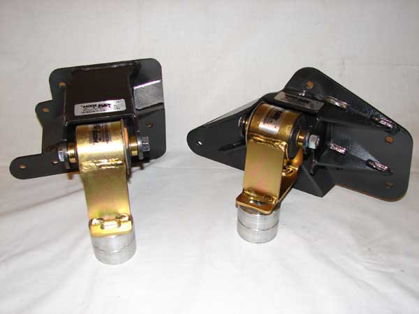 Two black and gold engine mounts on a white background. One mount is on the left, the other on the right