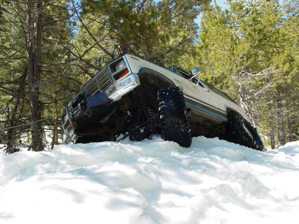 1986 Ford Bronco in snow, 3q-front view, white exterior