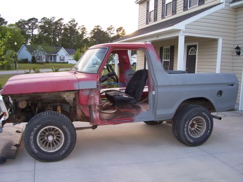 1978 Ford Bronco - This 1978 Ford Bronco is undergoing restoration, with its doors removed and primer applied to the rear section.