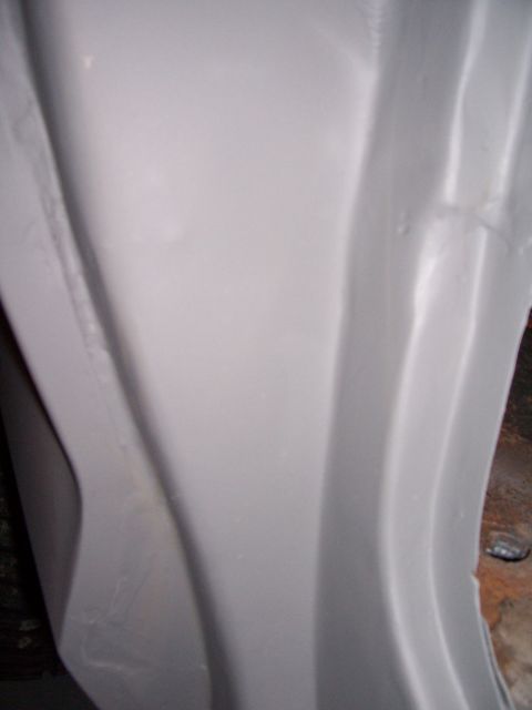 1978 Ford Bronco - Close-up of a vehicle's body panel, showing its shape and texture.