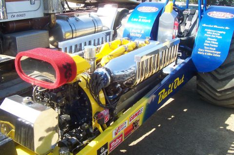 1994 Ford F-150 - A powerful dragster engine, identified as "Bail Out", is prominently displayed with its large red air filter and gleaming chrome exhaust co…