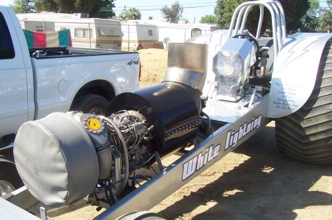 1994 Ford F-150 - Custom jet dragster named 'White Lightning' is parked next to a pickup truck.