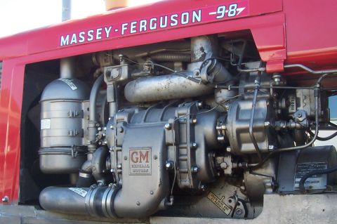 1994 Ford F-150 - Close-up of a Massey-Ferguson tractor engine, showing GM components and an air filter assembly.
