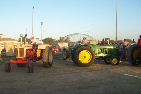1994 Ford F-150 - Several tractors are gathered outdoors, with people standing around them.