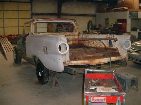1972 Ford Ranchero - This 1957 Ford Ranchero is undergoing restoration, with its bodywork in primer and significant rust visible.