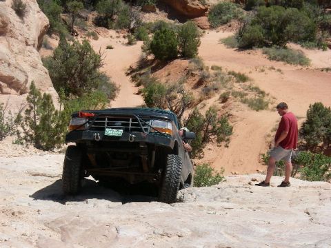 1996 Ford Bronco - Nathan making fun of me getting stopped and needing a strap. It's pretty steep but the spacing on two ledges is what stopped me.