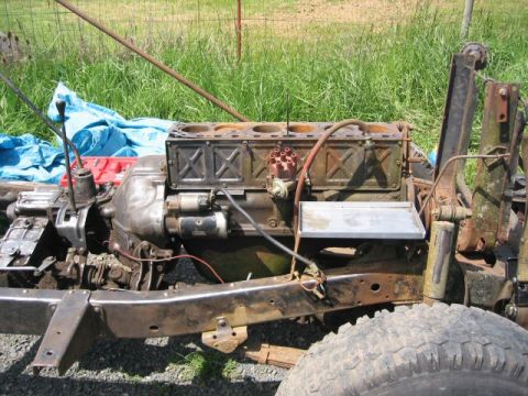 1991 Ford Explorer - Close-up of a vehicle's engine and chassis components, appearing to be under repair or disassembly.