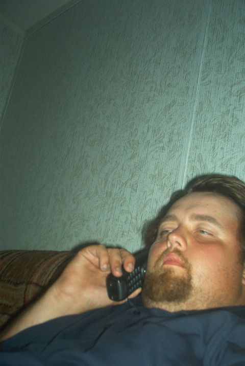 1985 Ford Crown Victoria LTD - Man on the phone in an indoor setting.