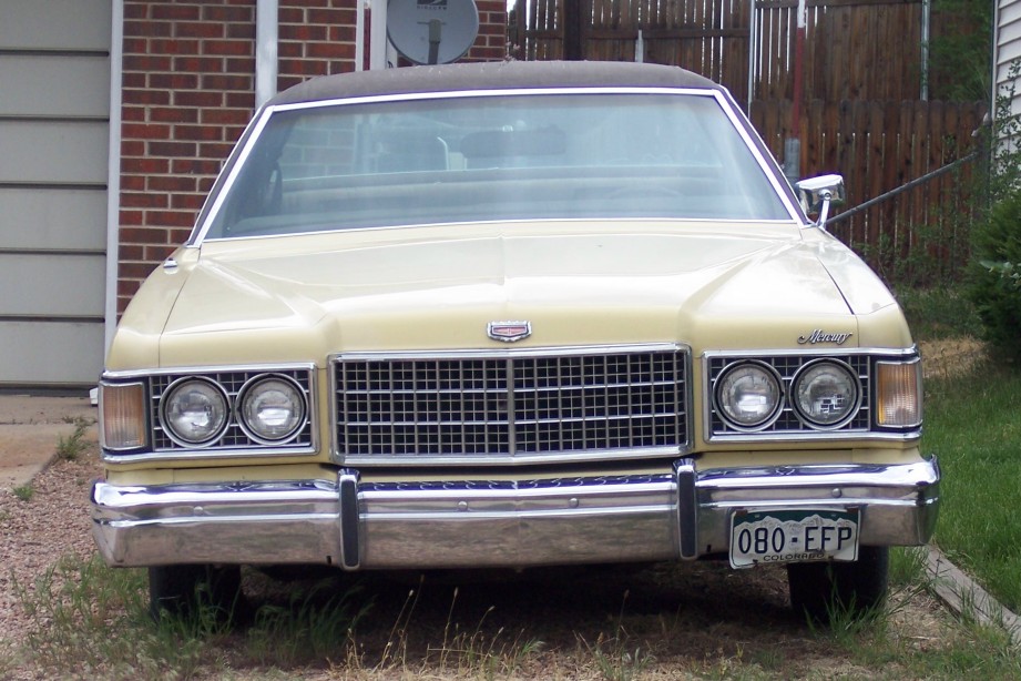 Front view of a yellow 1975 Mercury Marquis parked outside