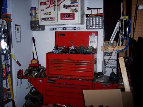 1972 Ford Ranchero - A red Snap-on toolbox is open and filled with tools, surrounded by various garage items and storage units.