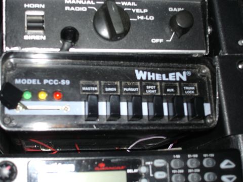 1999 Ford Crown Victoria - This is a Whelen Model PCC-S9 siren control panel, likely from an emergency vehicle.