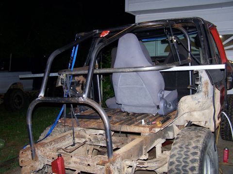 1979 Ford F-150 - This heavily modified vehicle appears to be undergoing a custom build, with a prominent roll cage and exposed chassis.