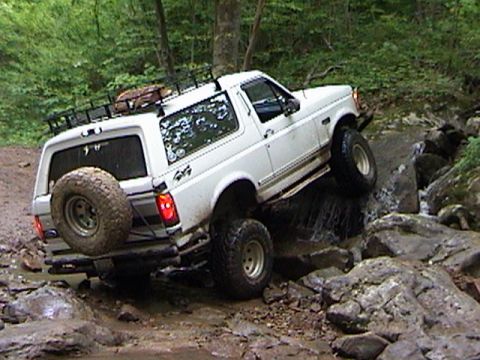 1996 Ford Bronco - This 1996 Ford Bronco tackles a challenging off-road course with water and rocks.