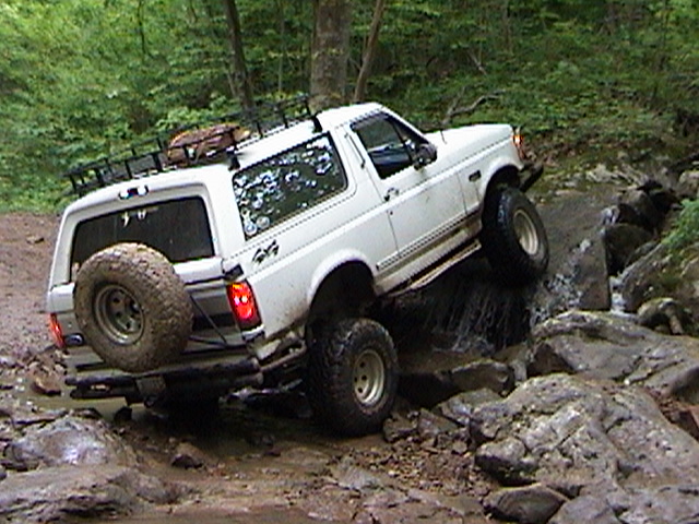 White 1996 Ford Bronco navigating rocky terrain