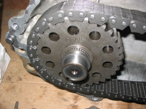 1995 Ford Bronco - Transfer case chain and gear assembly, showing the 'REAR' designation on the gear.