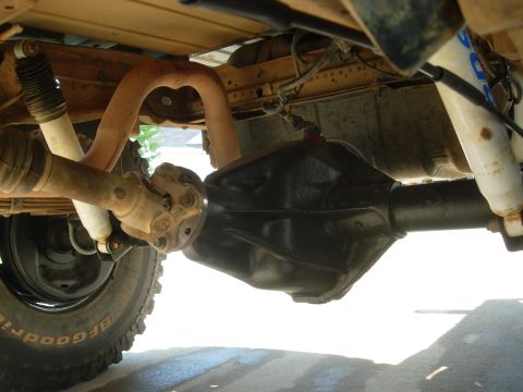 1995 Ford Bronco - Close-up of a vehicle's rear axle and driveshaft assembly, showing the differential housing.