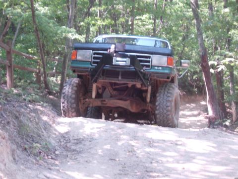 1995 Ford Bronco - This truck appears to be from the early to mid-1990s, likely a Ford F-150 or Bronco, modified for off-road use.