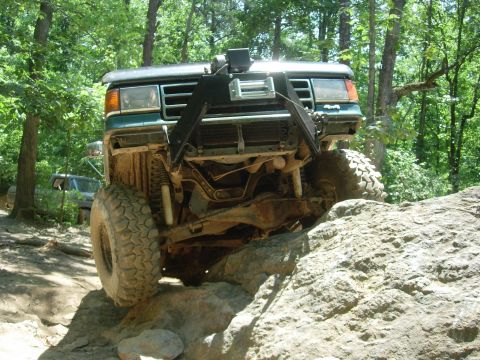 1995 Ford Bronco - This vehicle is navigating a rocky trail, with another vehicle in the background.