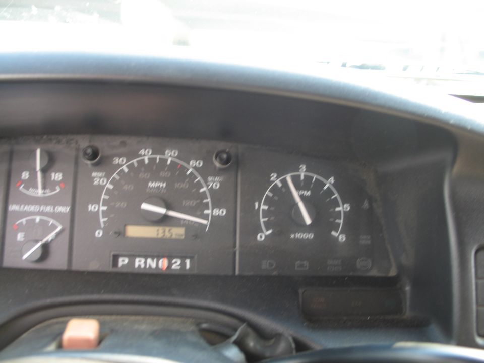 Interior dashboard with speedometer, tachometer, and PRND21 gear selector