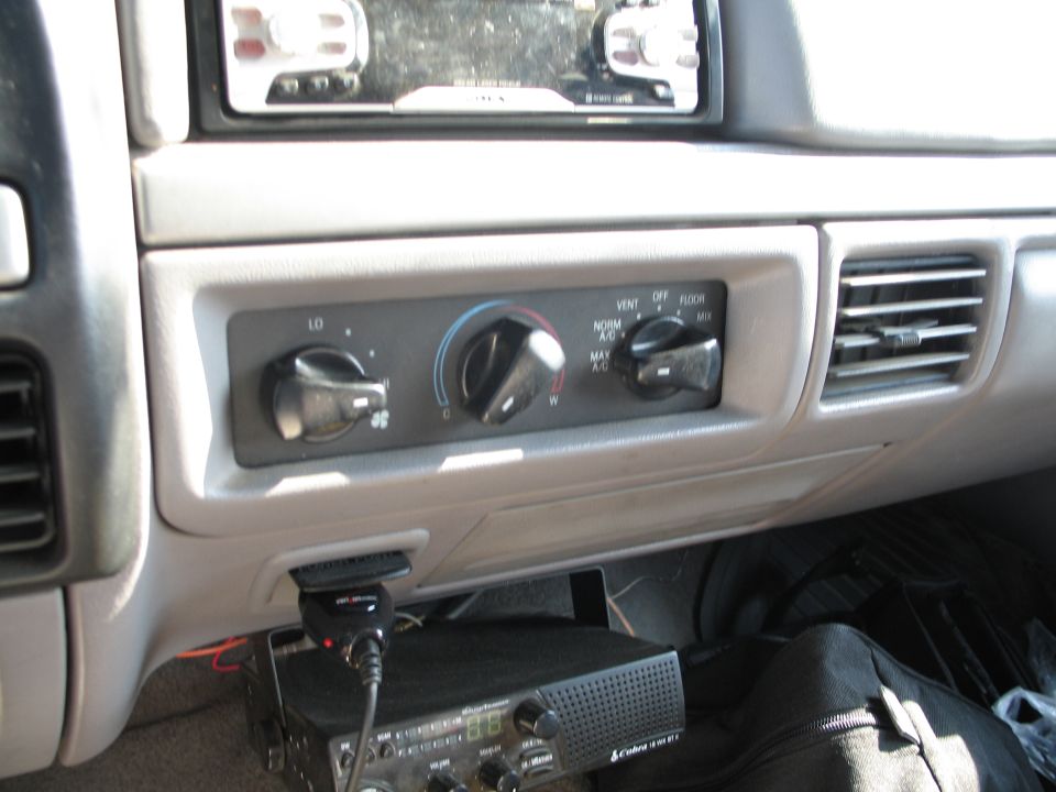 Dashboard with radio, climate controls, and CB radio installed