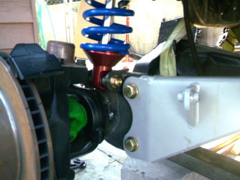 1989 Ford Bronco - This image shows a suspension part, not a complete vehicle. Text indicates SUPERMOTORS.