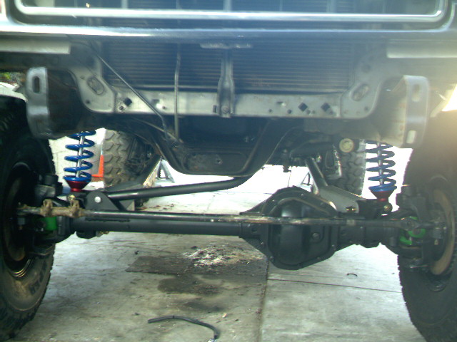 front axle and suspension components of a lifted truck