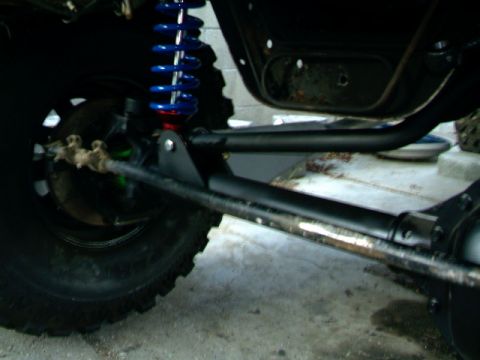 1989 Ford Bronco - Suspension components visible on an off-road vehicle, including a shock absorber and axle.