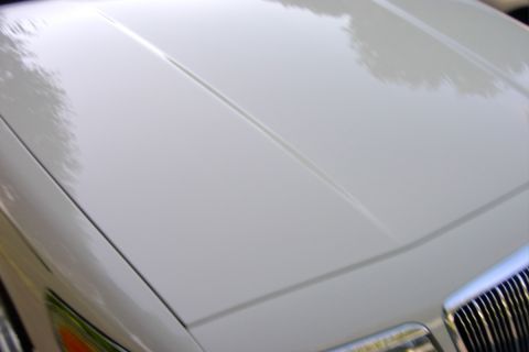 1996 Mercury Grand Marquis - The distinctive grille and hood lines of a 1996 Mercury Grand Marquis are visible in this close-up shot.