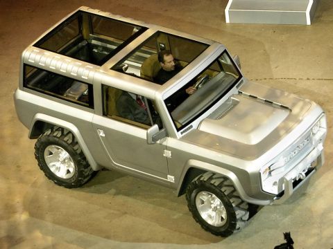 1996 Ford Bronco - This silver SUV features a distinctive panoramic glass roof and a stance, suggesting a concept vehicle.