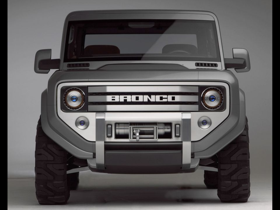 Silver Ford Bronco concept SUV front view with BRONCO grille, brush guard and winch