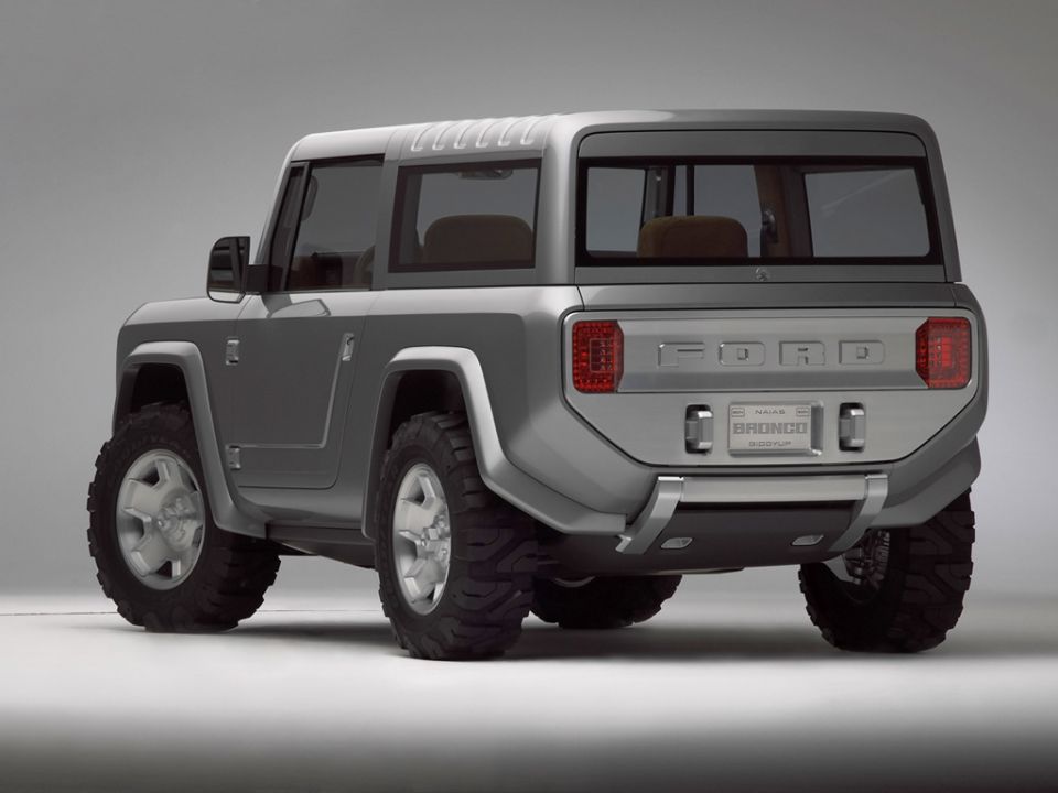 Silver two-door Ford Bronco concept SUV, rear three-quarter studio view