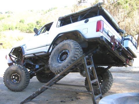 1996 Ford Bronco - This heavily modified 1996 Ford Bronco features an extended wheelbase, large off-road tires, and a custom soft top.