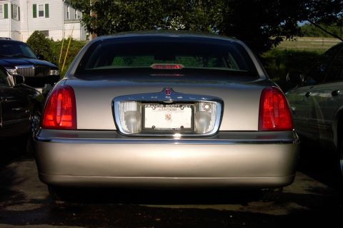 1996 Mercury Grand Marquis - This Lincoln Town Car has a distinctive rear end with vertical taillights and a chrome trim piece above the license plate.