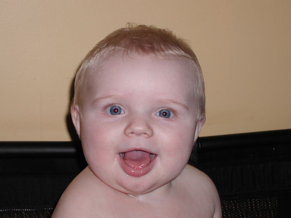 baby with blue eyes and blond hair, mouth open
