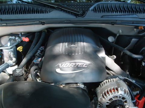 2004 GMC Sierra 1500 - Close-up of a Vortec engine cover in an engine bay, with a watermark visible.