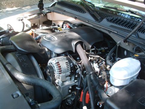 2004 GMC Sierra 1500 - Close-up view of the engine bay, showing various components and hoses.
