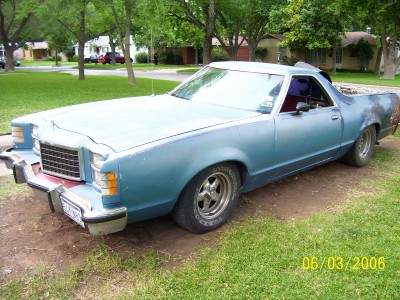 1972 Ford Ranchero - This 1972 Ford Ranchero is a light blue pickup truck with a white roof, viewed from the front three-quarter angle.