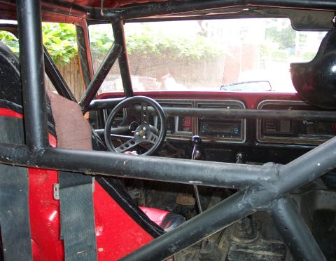 1978 Ford Bronco - Modified 1978 Ford Bronco interior shows a full rollcage and racing seat.