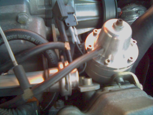 Close-up of a polished adjustable fuel pressure regulator and fuel rail in a BMW Z3 engine bay