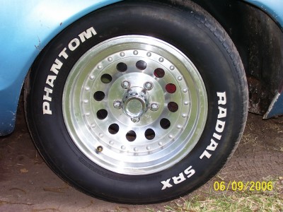 1972 Ford Ranchero - A close-up view of a car's wheel and tire, showing the brand names "Phantom" and "Radial SRX" on the tire.