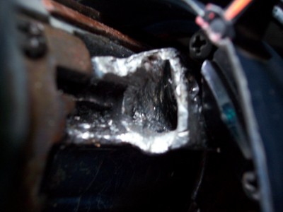 1972 Ford Ranchero - This close-up shows a damaged metal bracket with exposed wires, indicating a need for repair.