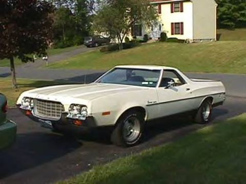 1972 Ford Ranchero - A white 1972 Ford Ranchero is parked on a driveway in front of a house.