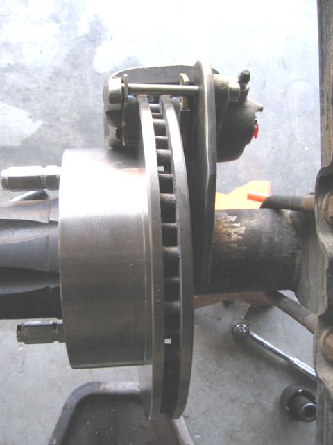 1994 Ford Bronco - Disc brake assembly with rotor and caliper shown in detail.