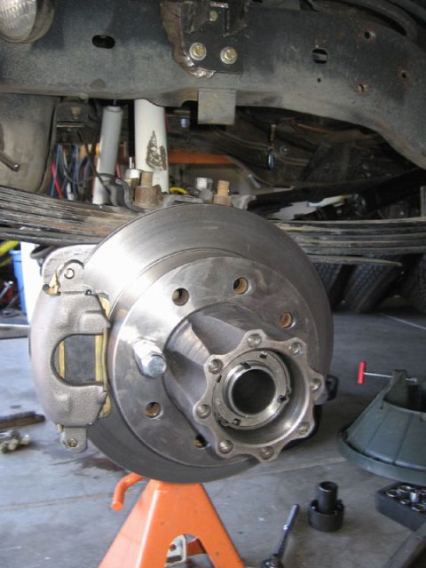 1994 Ford Bronco - Close-up of a vehicle's disc brake assembly, highlighting the rotor and caliper.