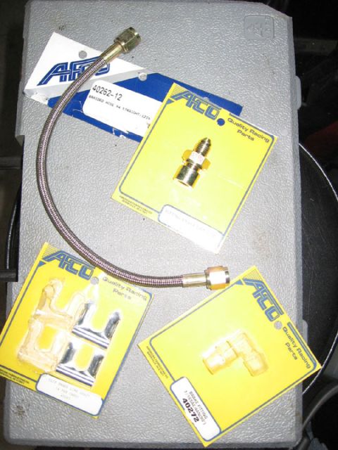 1994 Ford Bronco - Braided brake hose and assorted fittings, likely for a custom brake line setup.
