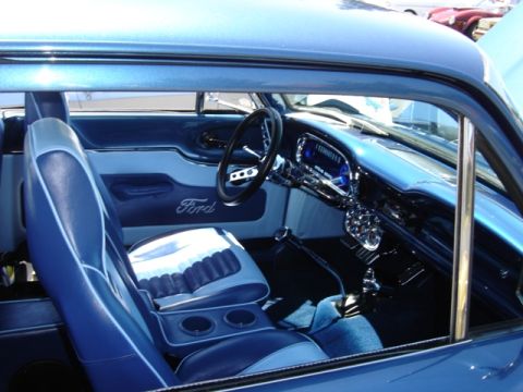 1972 Ford Ranchero - The interior of a classic Ford features two-tone blue seats and a dashboard with chrome accents.