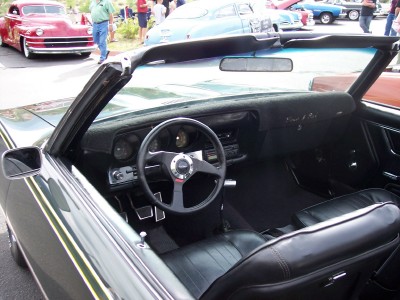 1972 Ford Ranchero - The interior of a convertible is shown, with a view of other vehicles in the background.
