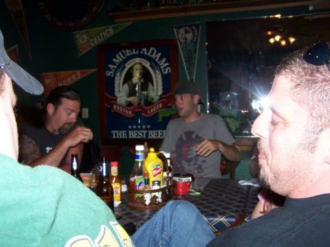 1995 Ford Bronco - Friends gather at a table, with a prominent Samuel Adams beer advertisement in the background.